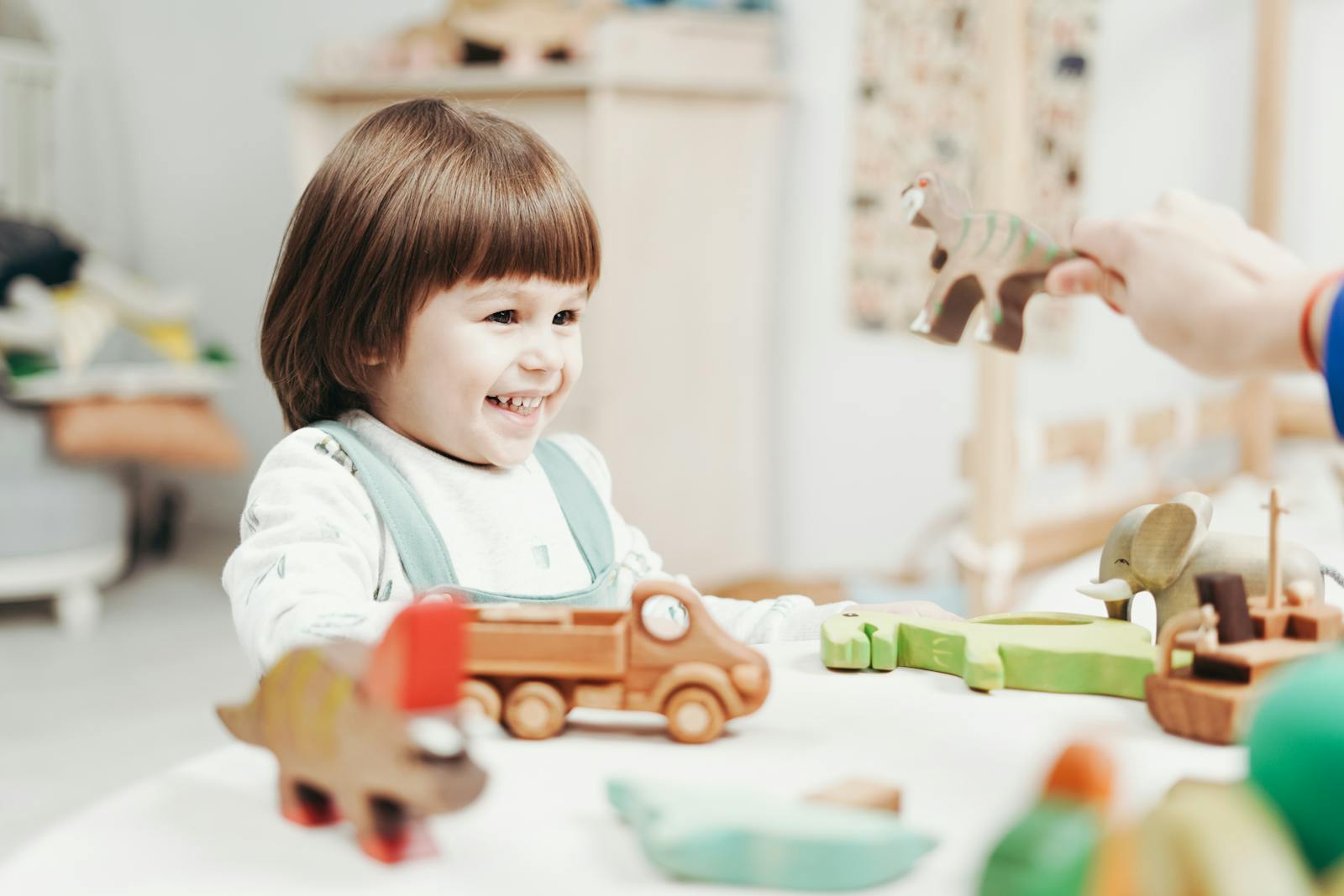 Young girl playing with toys.