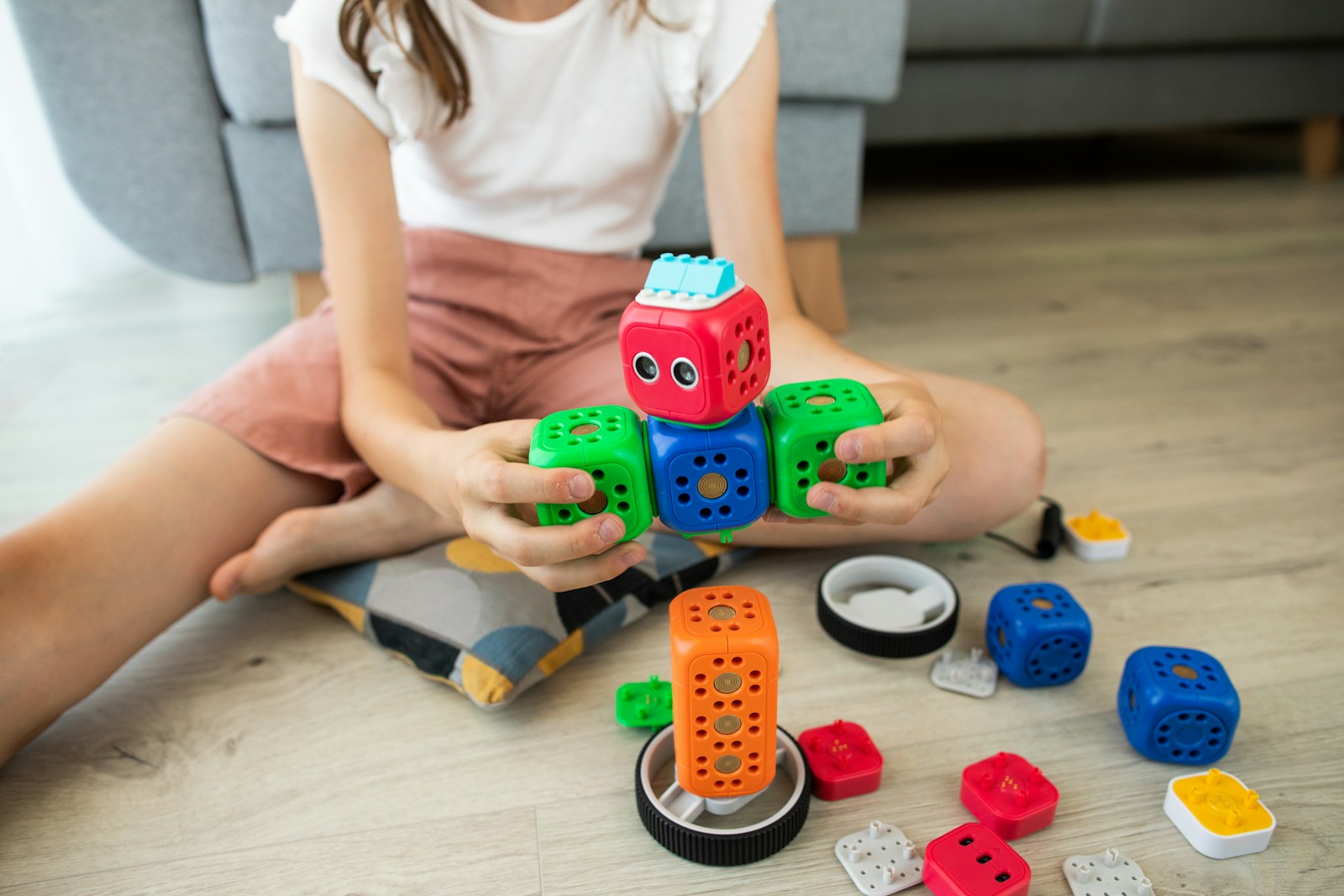 A child in structured play, playing with blocks